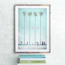Miami Vintage Travel Poster Artwork in Wooden Frame. Interior shot of art print and book collection. Artwork by Henry Rivers